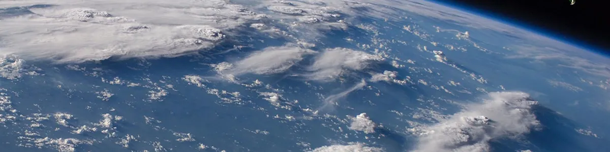 A rendering of three INCUS satellites overflying convective storms on Earth