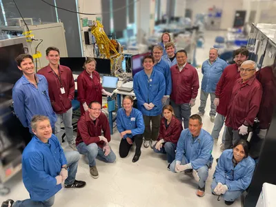 The JPL and BCT teams pose in front of INCUS Observatory 1