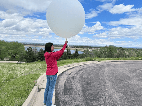 A picture of a student launching a sounding.