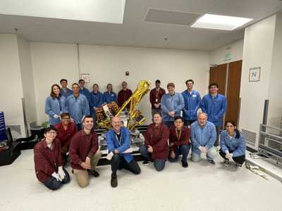 The JPL and BCT teams pose in front of INCUS Observatory 1