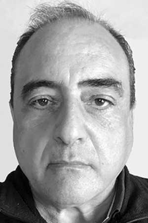 A black and white headshot of Ziad Haddad