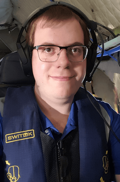 A headshot of Corey Amiot