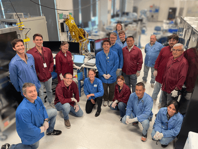 The JPL and BCT teams pose in front of INCUS Observatory 1