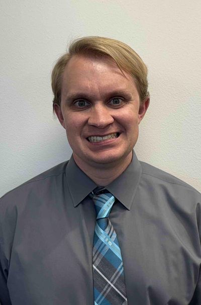 A headshot of Nick Falk